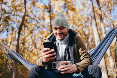 Man checking phone outside