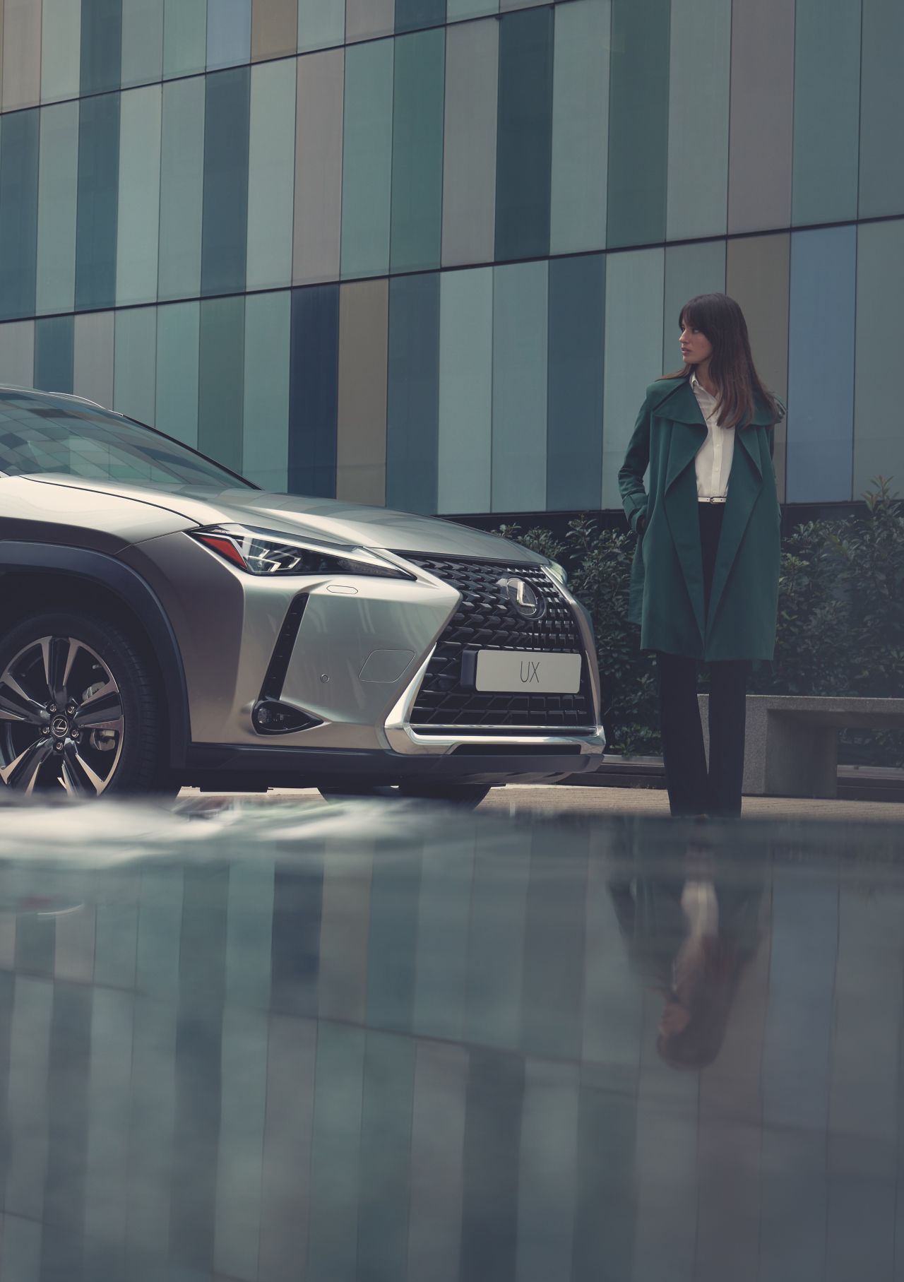 woman looking at a Lexus car