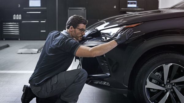 man working on a Lexus car