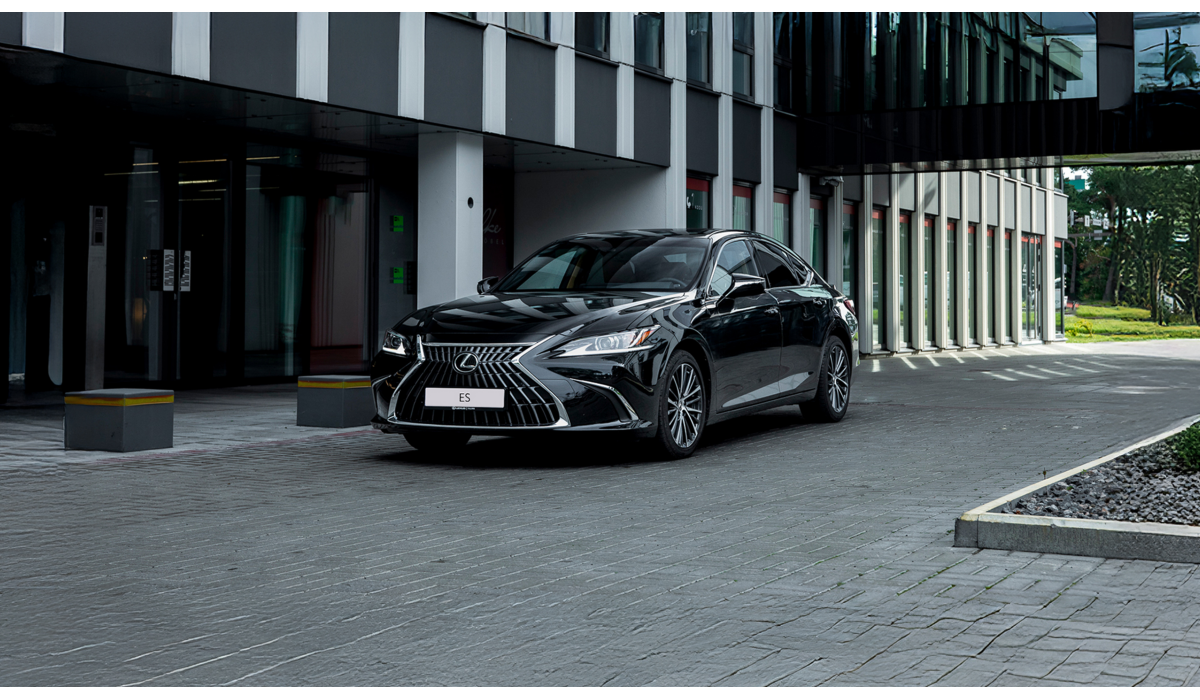 A Lexus ES driving on a road