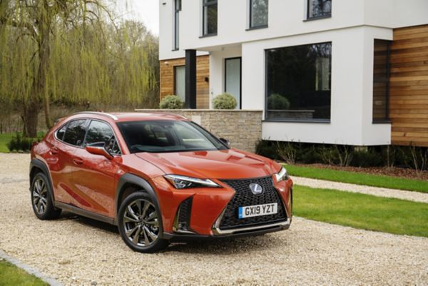A Lexus RX 450h and NX 300h in a garage 