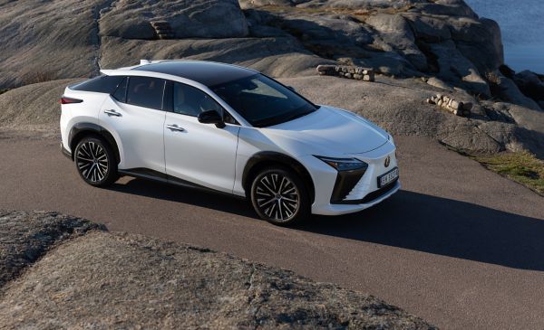 Front view of the Lexus RZ 450e driving in a rural location