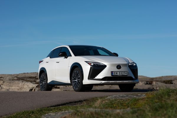 Lexus RZ driving in a mountainous location