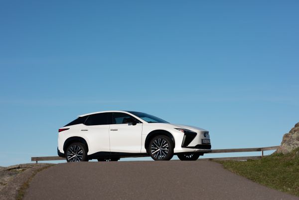 Front view of the Lexus RZ 450e driving in a rural location