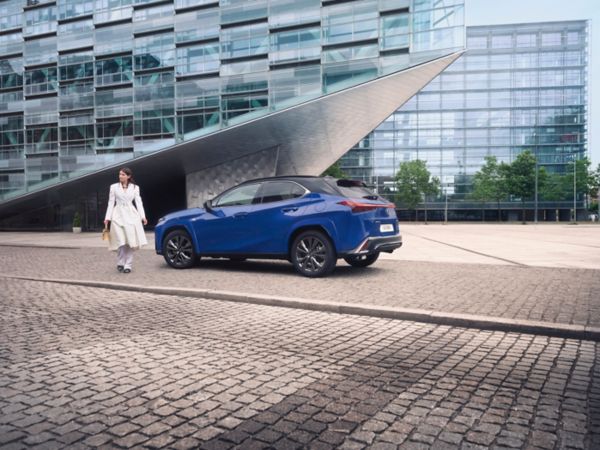  Lexus UX driving in a city