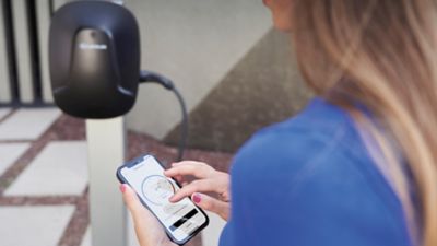 A person using a mobile phone to access the Lexus Link+ app