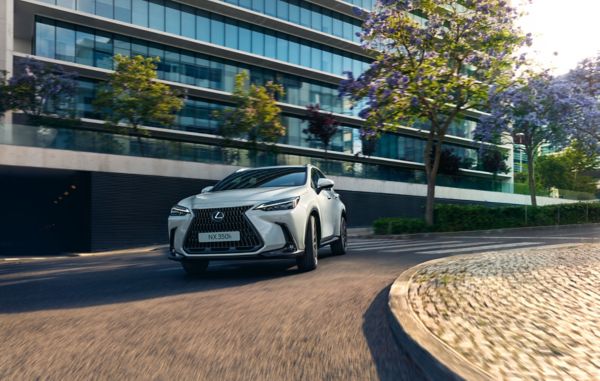 A Lexus NX driving on a road