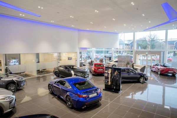 a variety of Lexus cars in a showroom