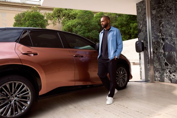 Man outside a Lexus RZ