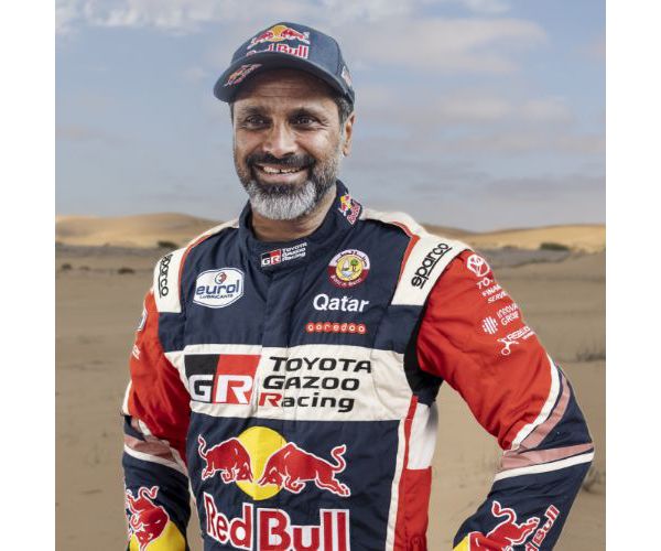 Team 1, Car 200 Driver Nasser Al-Attiyah with hands on hipe smiling to camera