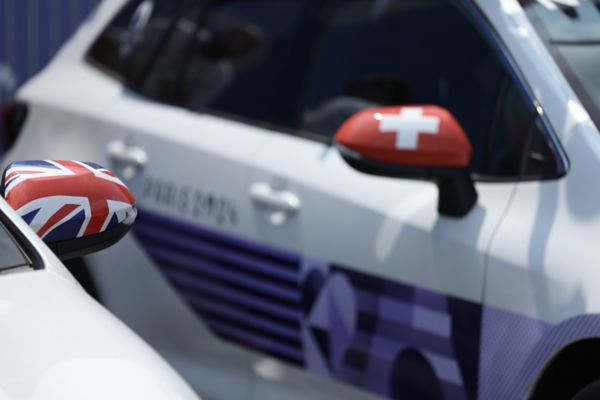 National flag stickers of Switzerland and UK  applied to a white Corolla
