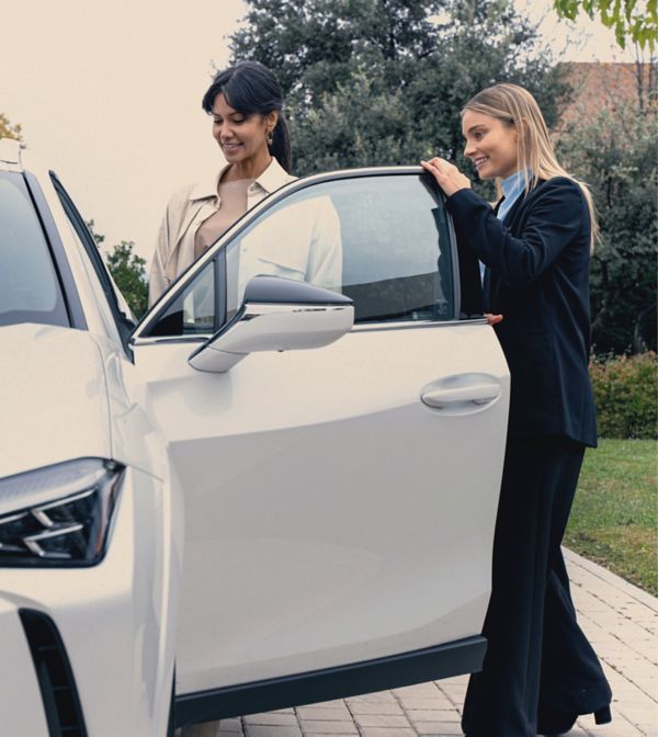 Woman getting into Lexus car