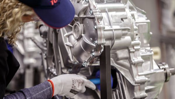 Toyota technician working on engine