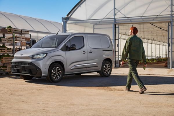 Woman walking towards Toyota Proace City