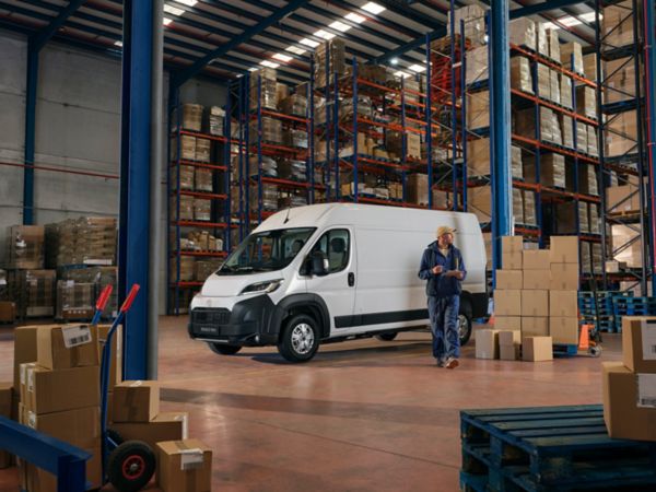 The big and bold Proace Max in a busy warehouse 