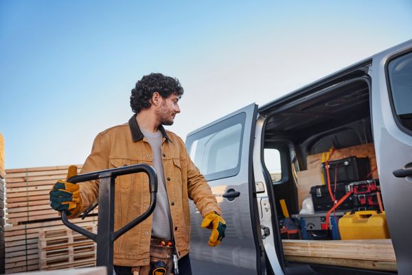 person looking inside a Proace van