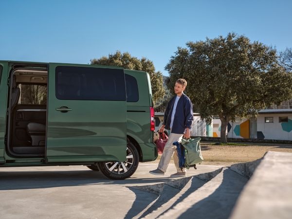 An owner activates the hands-free, powered sliding door