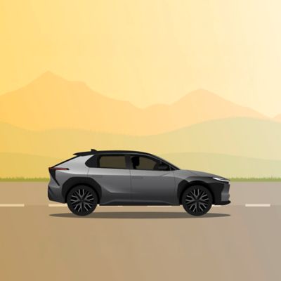 Abbildung eines Toyota bZ4X, der entlang einer Strasse fährt