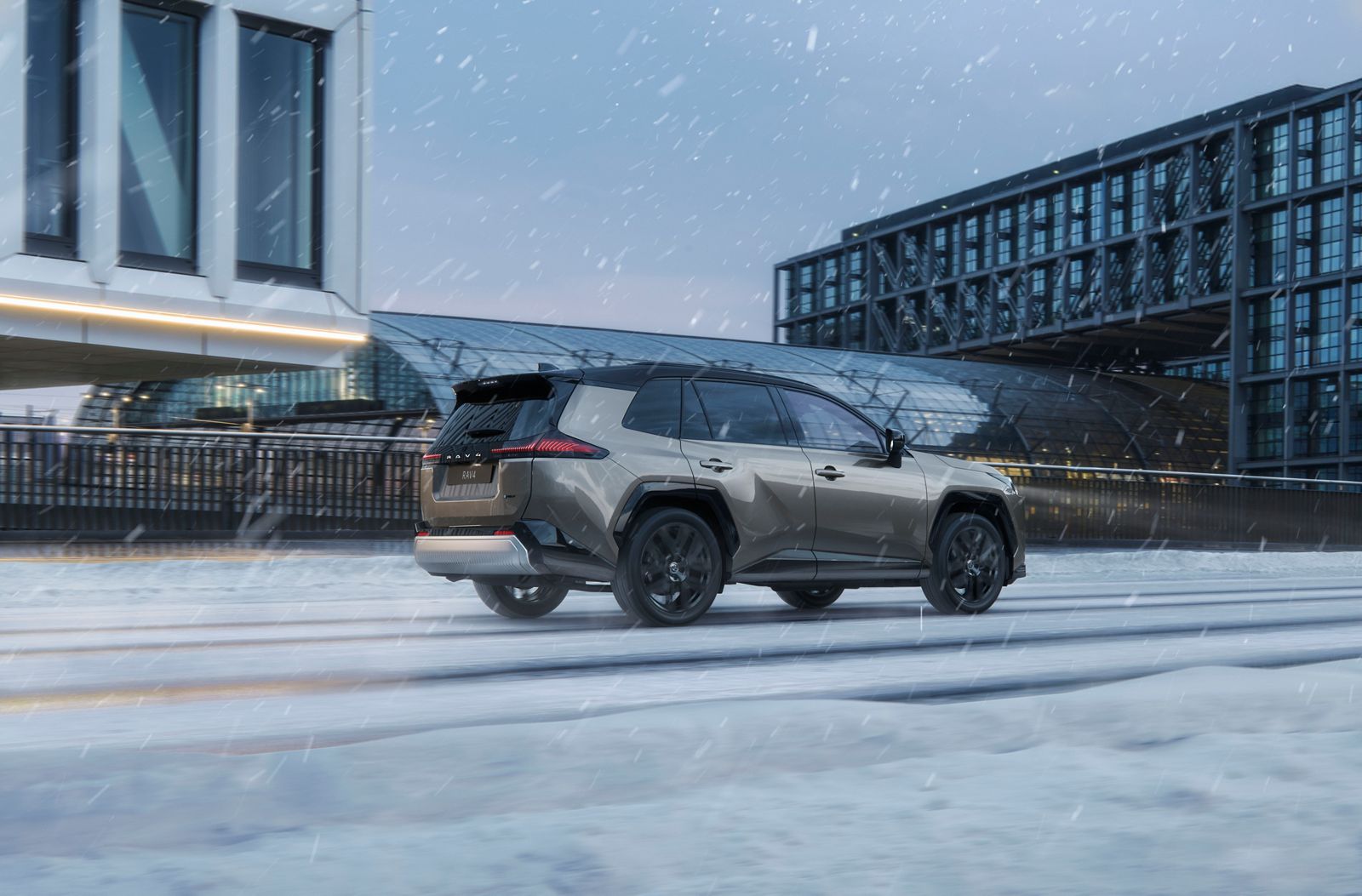RAV4 driving in the city in the snow.