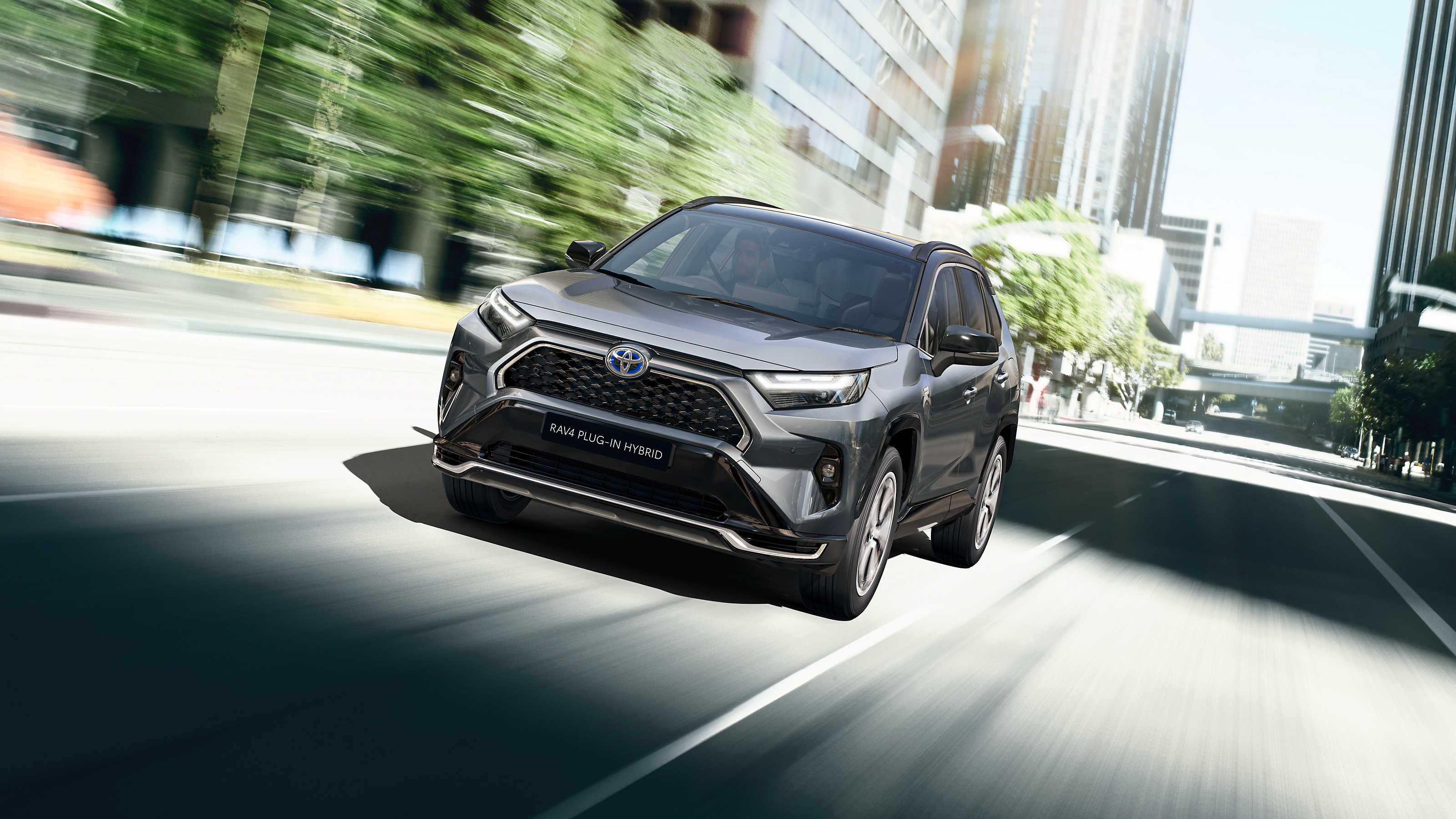 A RAV4 driving on a road