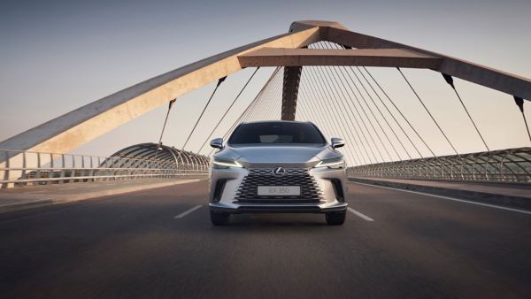 Front view of the Lexus RX driving on a bridge