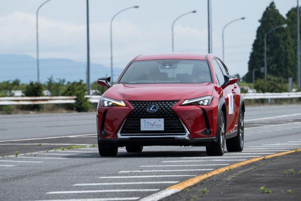 Red Lexus BEV car with manual transmission