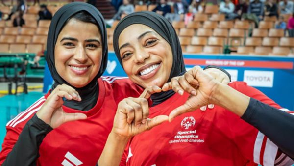 Alpine skiing competition winner is celebrating on a podium in Sestriere, Italy at the Special Olympics Winter World Games Turin 2025