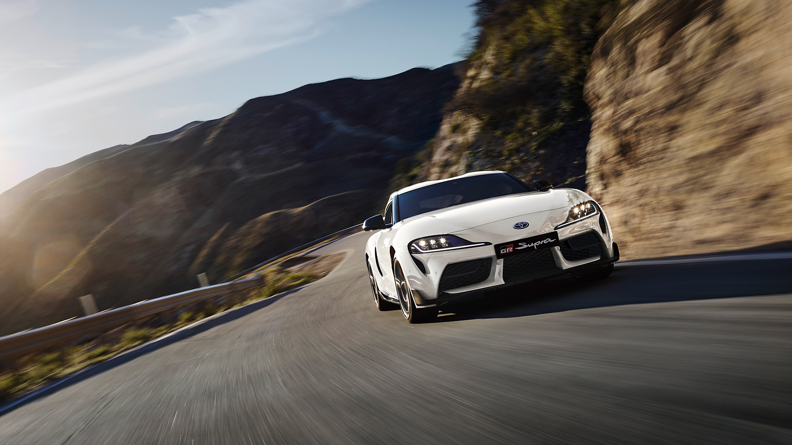 GR Supra at speed on a twisting mountain road