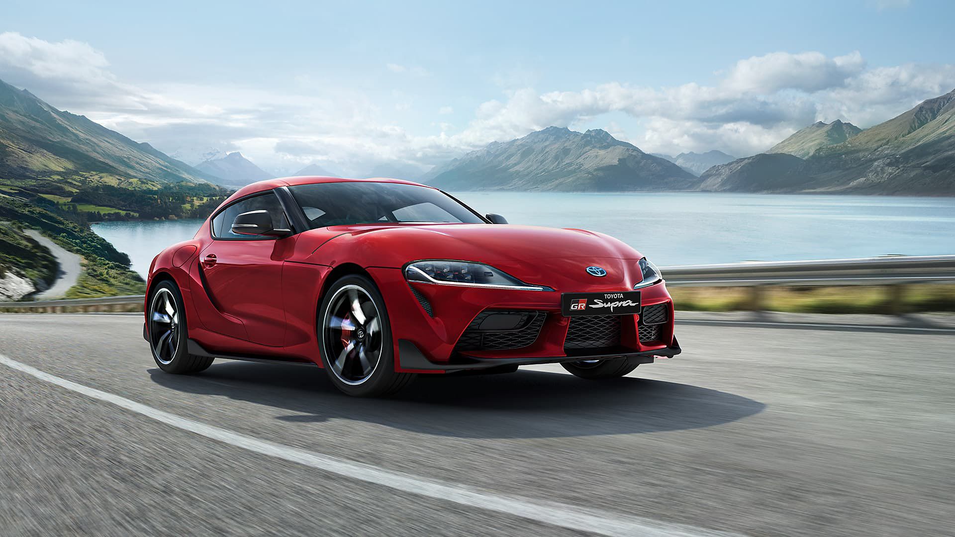 Toyota Supra driving along a road