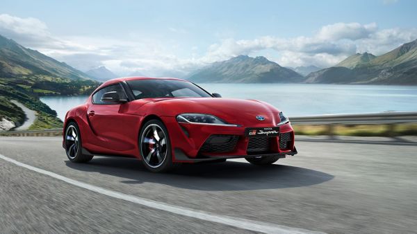 Toyota Supra driving along a road