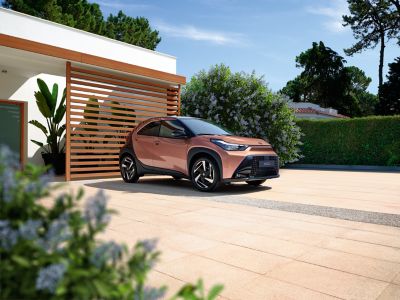 Toyota Aygo X Hybrid in sunny courtyard