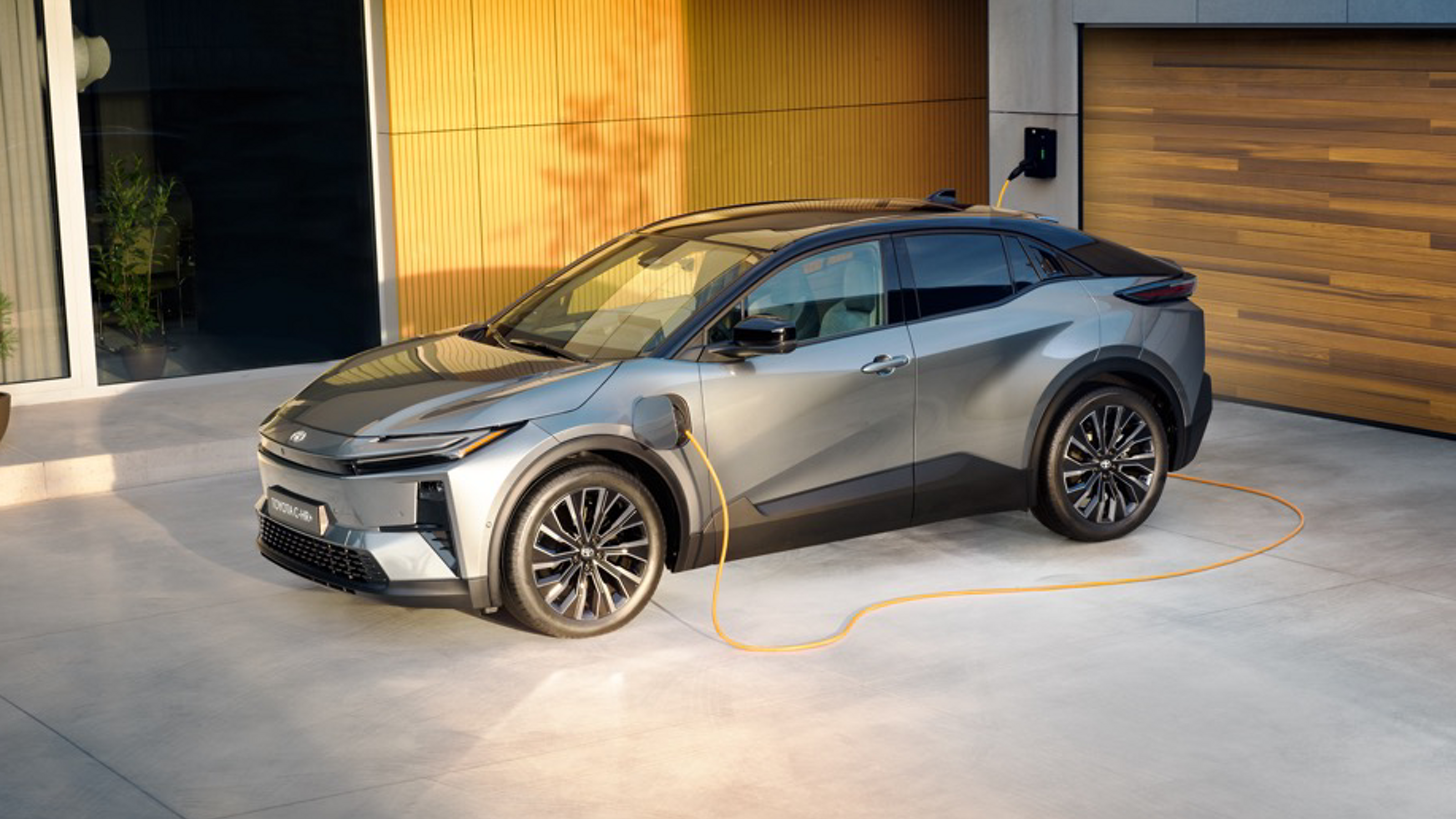 An owner charges a Toyota C-HR Plug-in Hybrid at home 