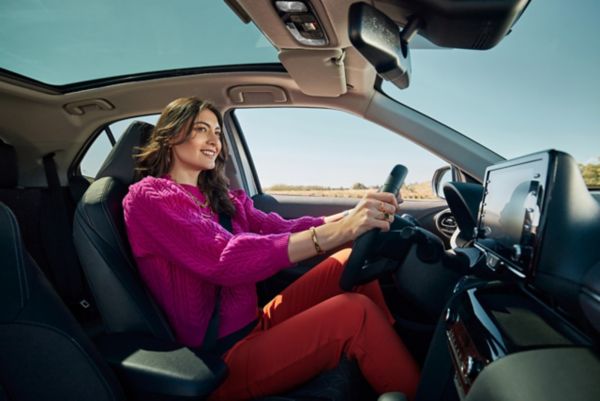 Woman driving vehicle