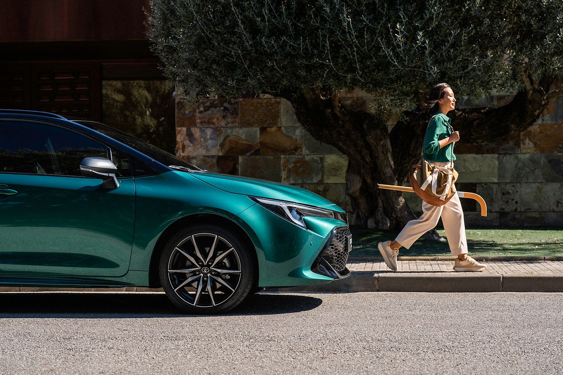 Toyota Corolla Touring Sports driving on city road