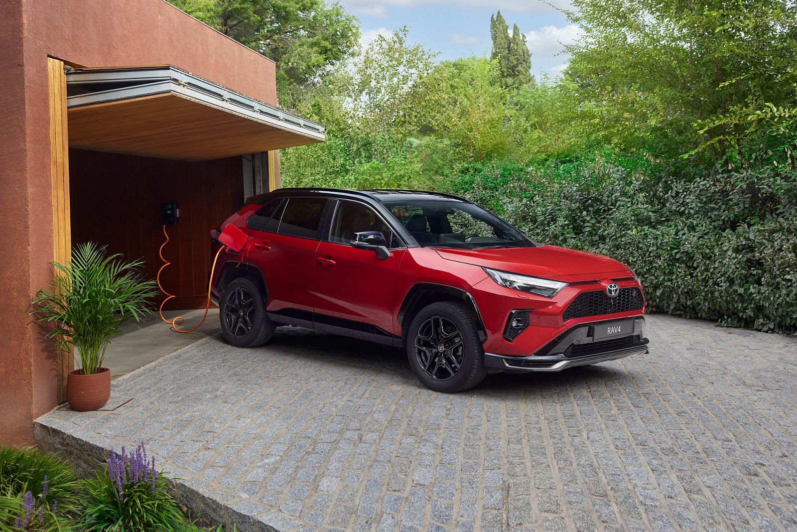 A RAV4 driving in an amazing urban settings