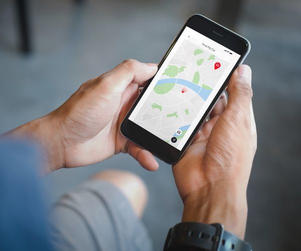 person looking at MyToyota app on phone
