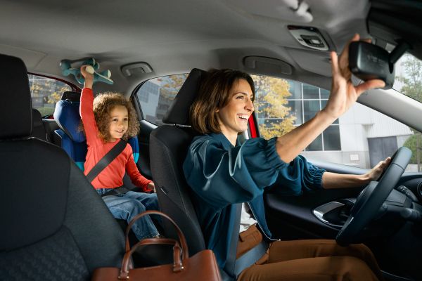 Happy mum and daughter in Toyota Vehicle