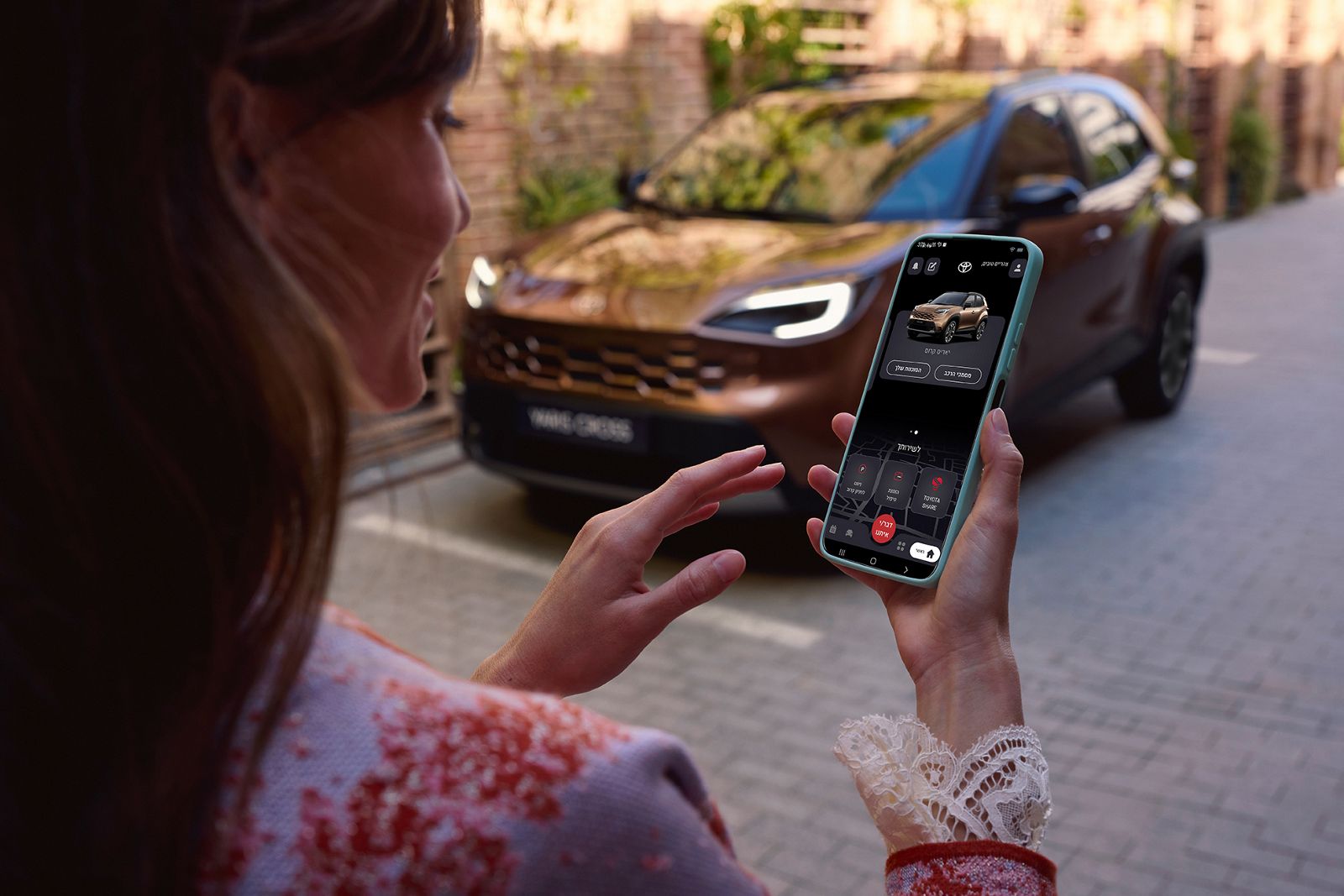 Yaris Cross driver using MyToyota app