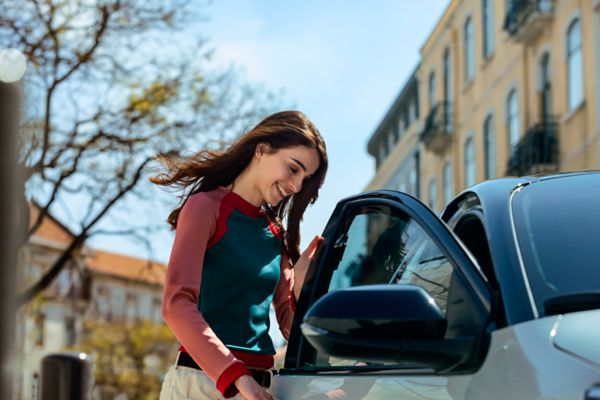 Woman opening car door