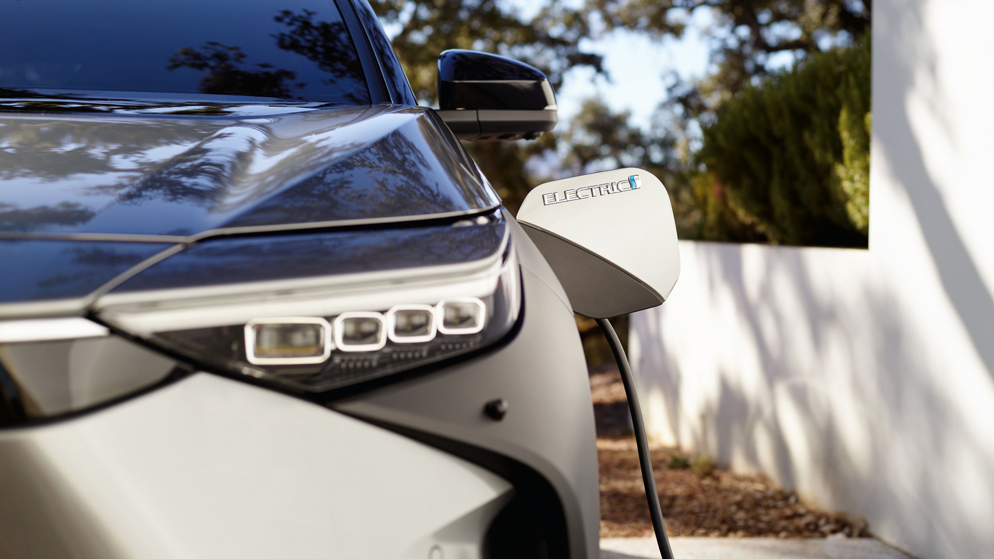A Battery Electric Toyota bZ4X being charged at home