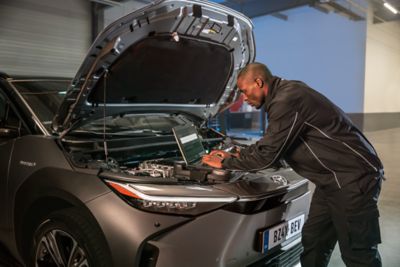 Toyota mechanic working on car