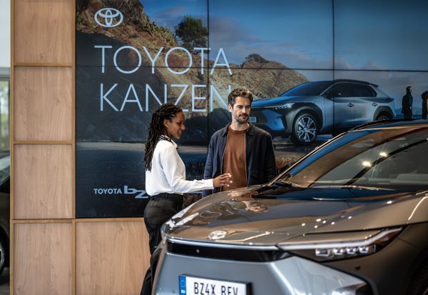 Toyota employee helping a customer