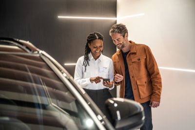 Consultant advising customer at Toyota dealership