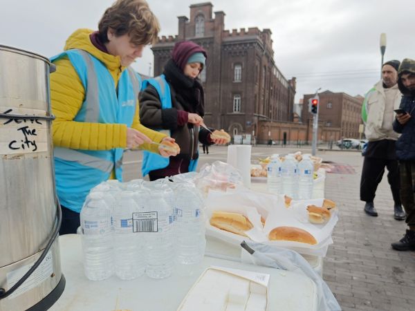 Toyota employees volunteering by distributing food in the city