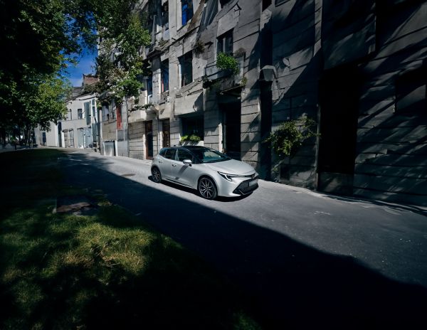 Corolla Hatchback driving on city road