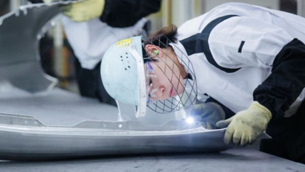 person working in a Lexus factory