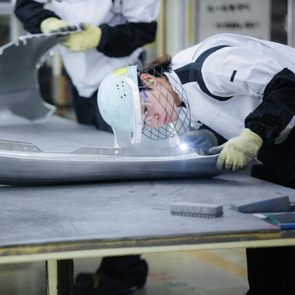 woman working in a Lexus factory