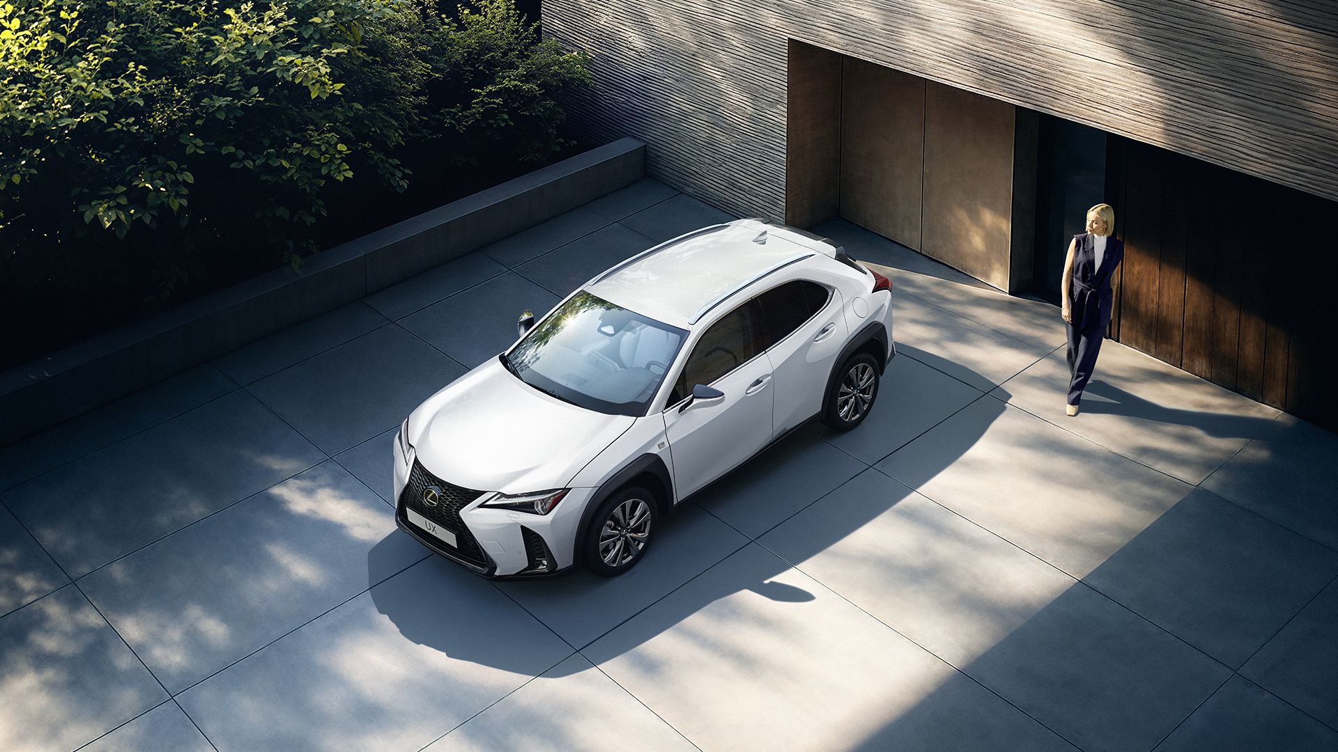 Rear three-quarter view of a parked Lexus UX 300h
