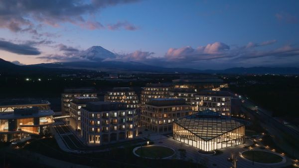 Uitzicht op Toyota Woven City verlicht ’s avonds