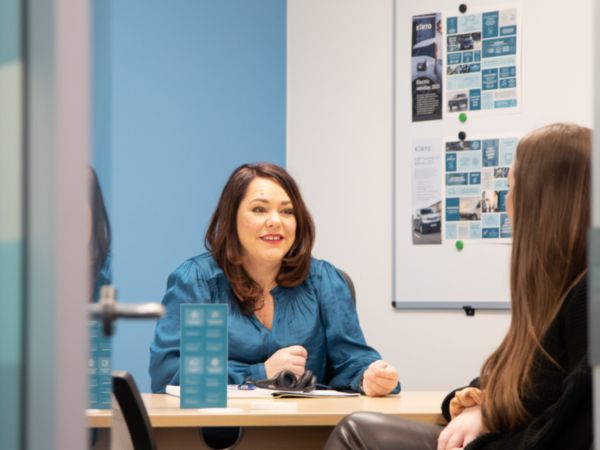Woman smiling while having a conversation
